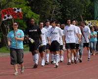 Athletes march into the soccer field